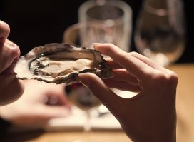 woman eating oysters
