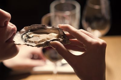 woman eating oysters