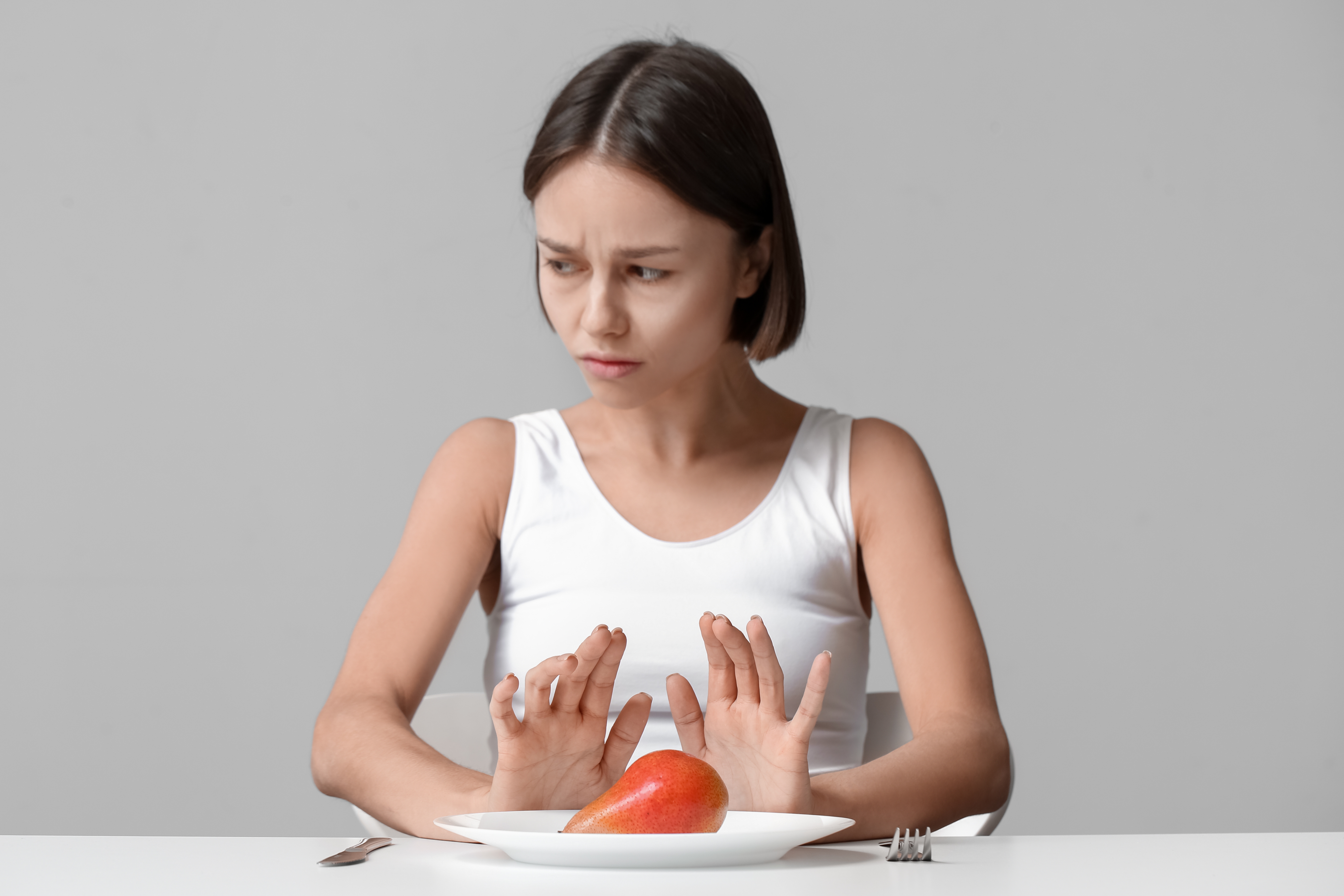 thin woman refusing food