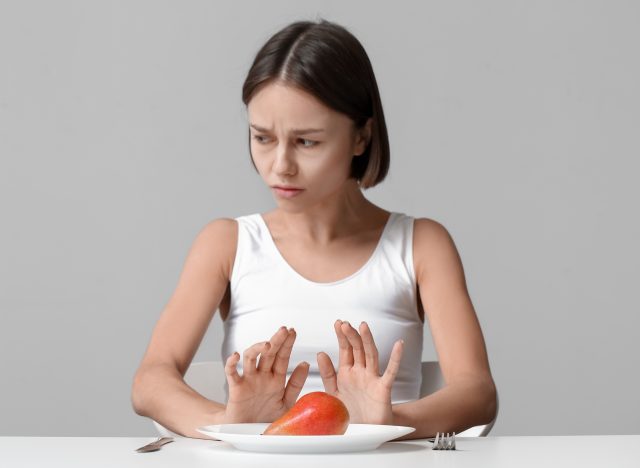 thin woman refusing food
