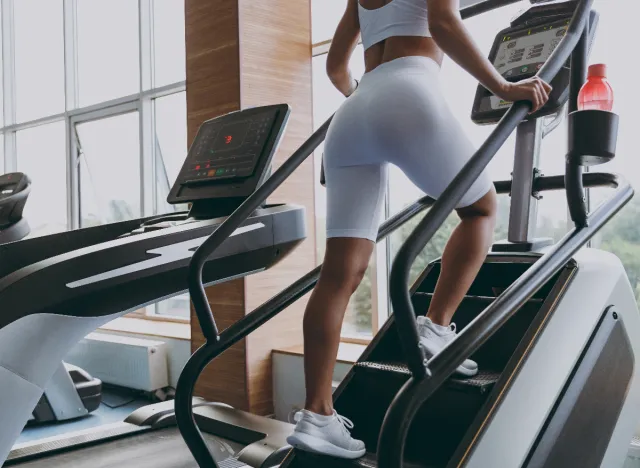 woman close-up legs doing stair climber workout