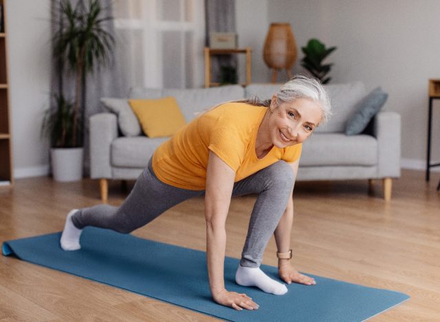woman doing runner's lunge at home