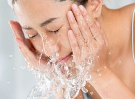 woman washing her face, over-washing concept of bad hygiene habits