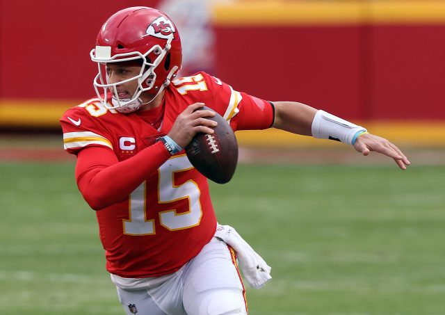 Quarterback Patrick Mahomes #15 of the Kansas City Chiefs scrambles during the AFC Divisional Playoff game against the Cleveland Browns at Arrowhead Stadium on January 17, 2021 in Kansas City, Missouri.