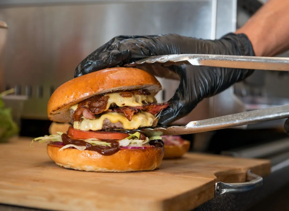 Chef building burger