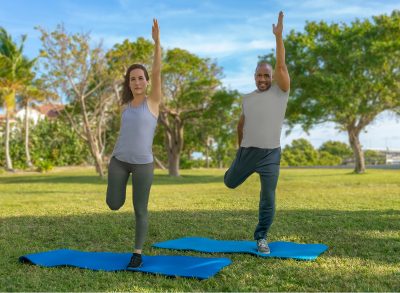 couple in park demonstrating exercises to regain balance after 40