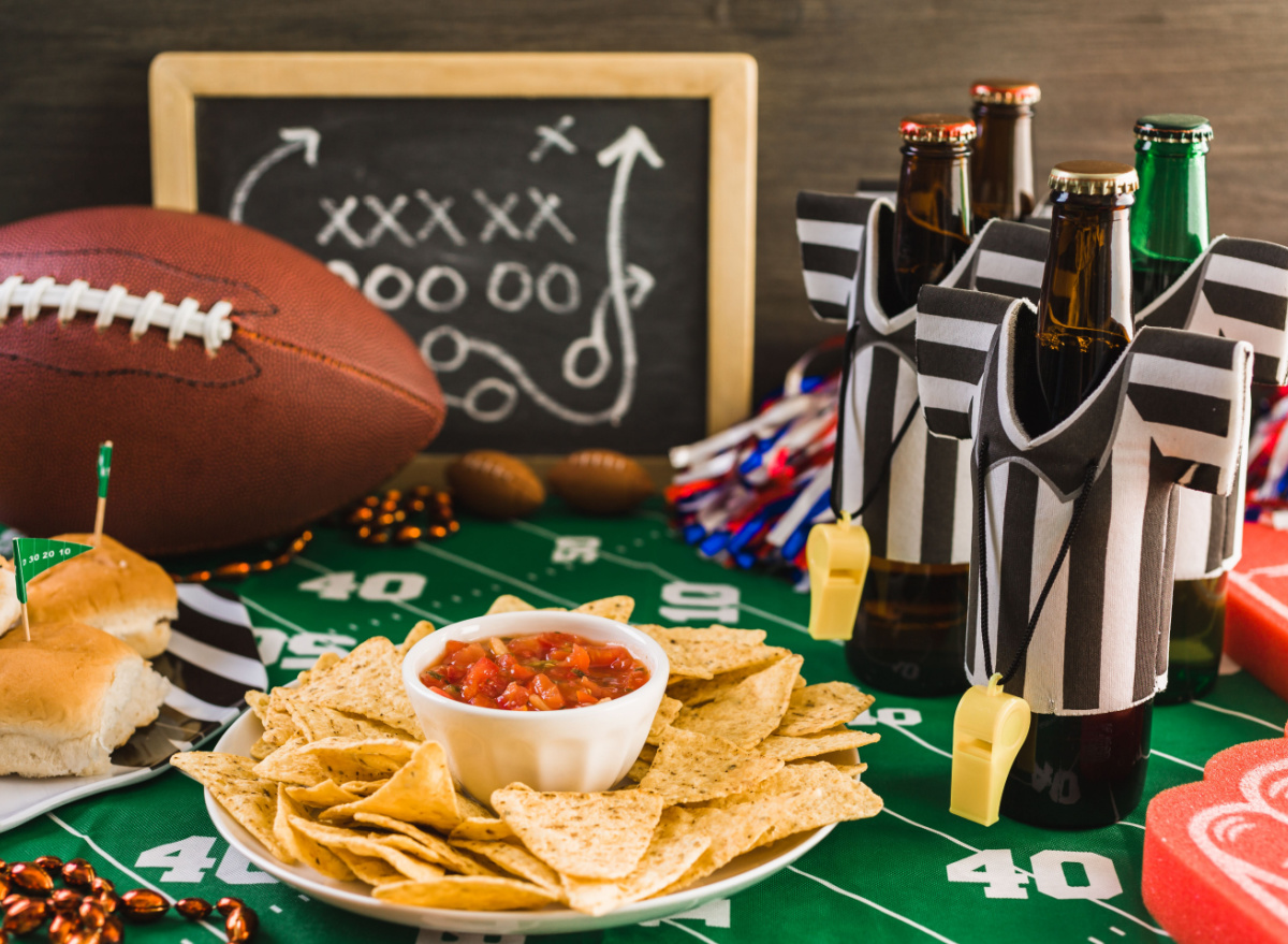 football party table with chips, salsa, and beer