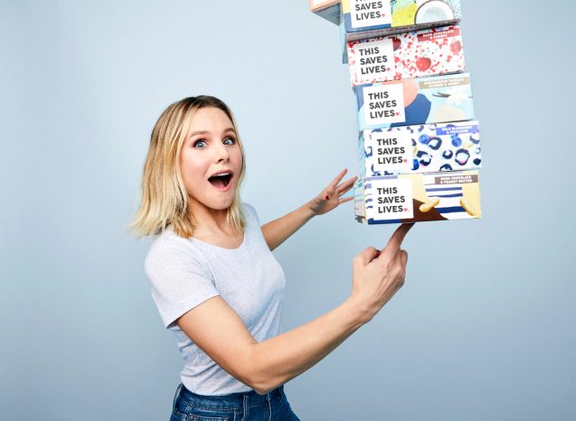kristen bell holding this saves lives snack boxes