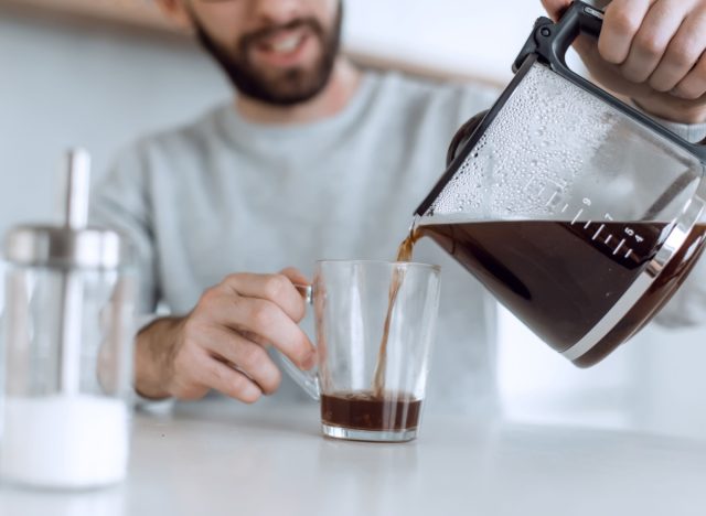 man pouring himself a cup of coffee