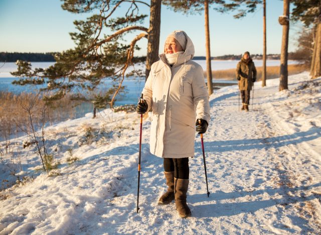 mature couple on a winter walk by the lake, sneaky ways to get more exercise