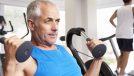 mature man working out at the gym on weight machine, demonstrating bad exercise habits that increase your risk of injury