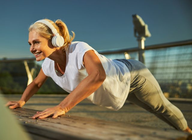 mature woman performing alternate pushups, concept of workout to get your body back to 40