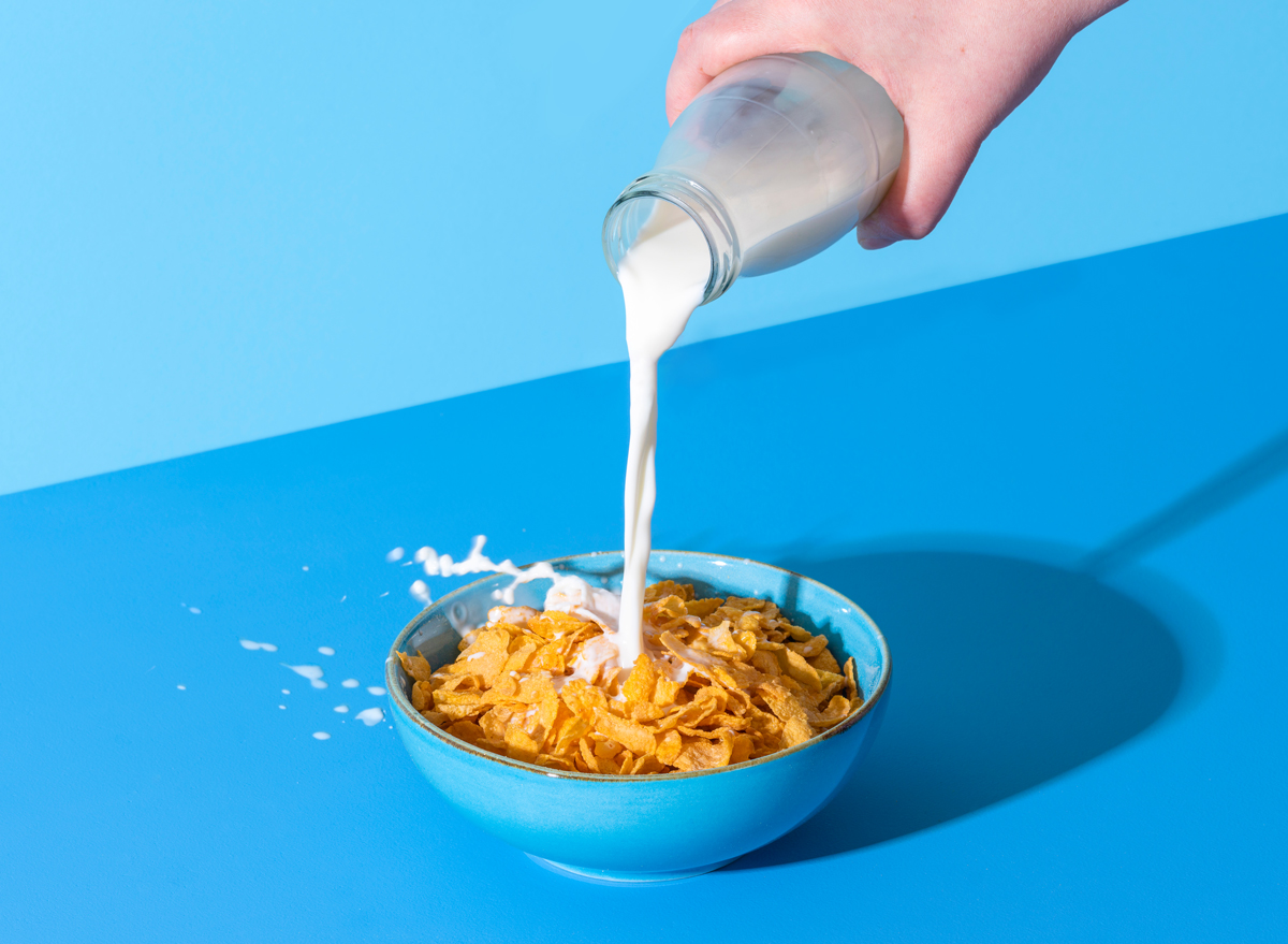 Pour milk into bowl of cereal