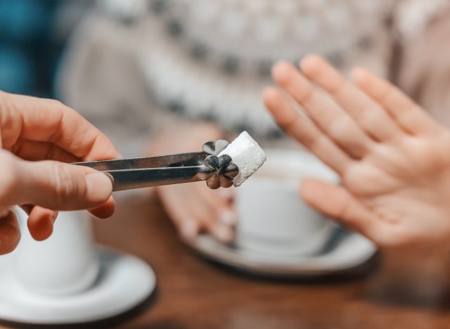 refusing sugar cube for coffee, concept of how to cut out sugar for weight loss