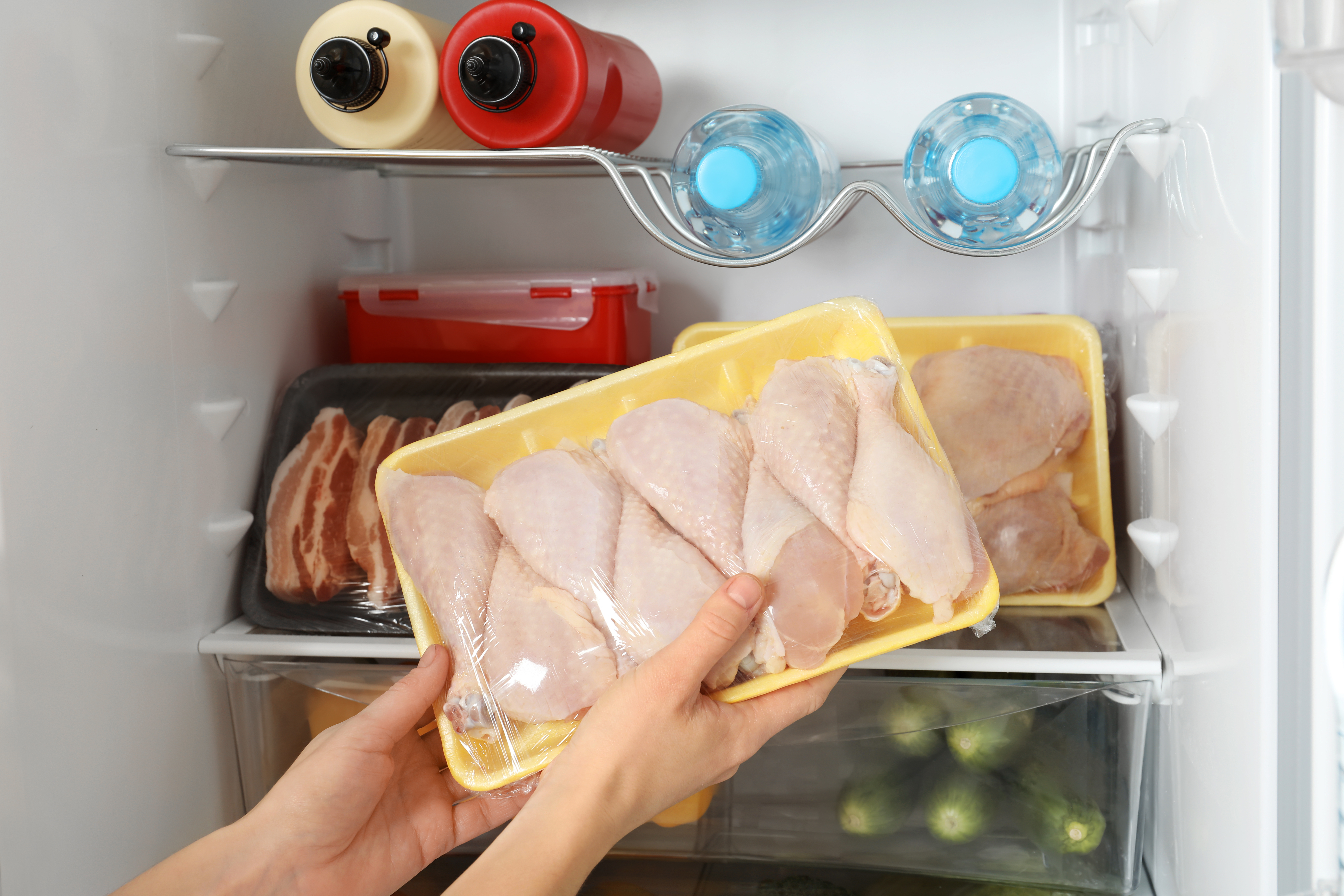 taking raw chicken out of the fridge