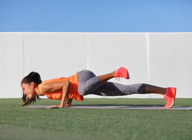 woman doing spiderman planks, at-home exercises to keep your weight down for good