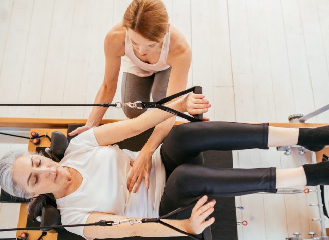 woman doing supine arms Pilates exercise