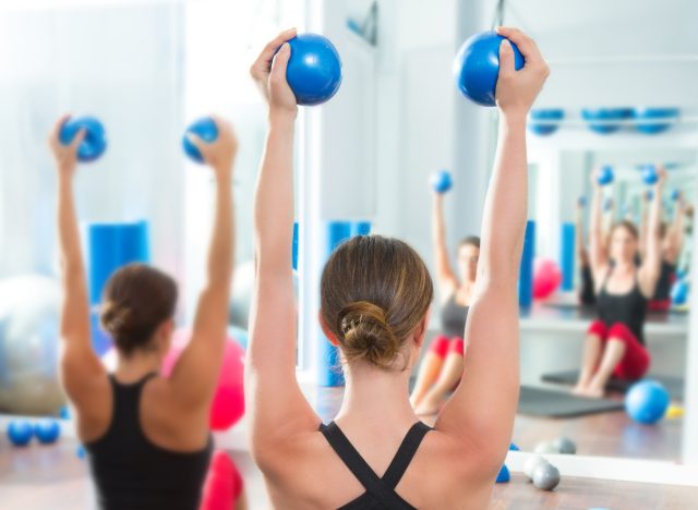 toning ball overhead press exercise to lose arm fat fast