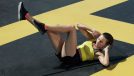 woman doing bicycle crunches exercise, part of core workout
