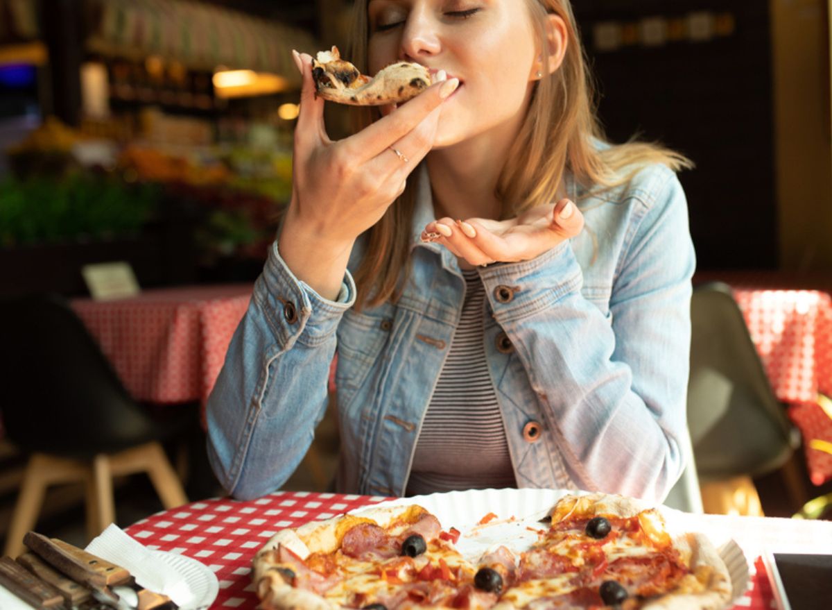 Woman enjoying pizza