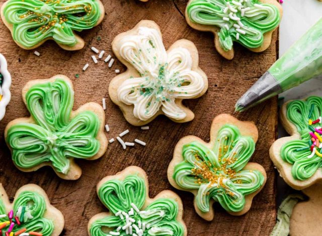 Shamrock frosted cookies on a table