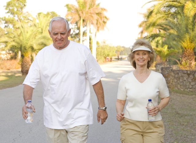 active senior couple walking outdoors