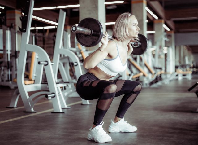 barbell back squat at the gym