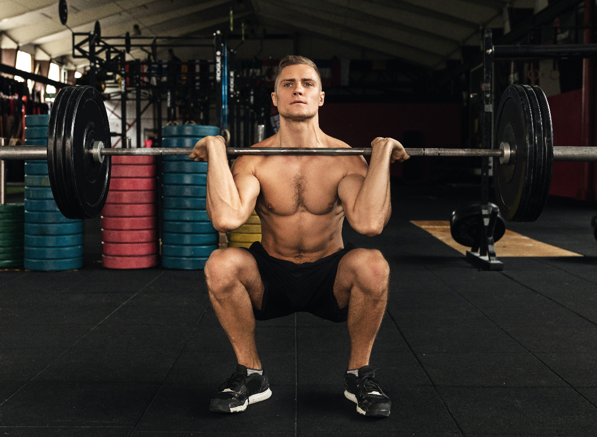 man doing barbell front squat quad exercises for men