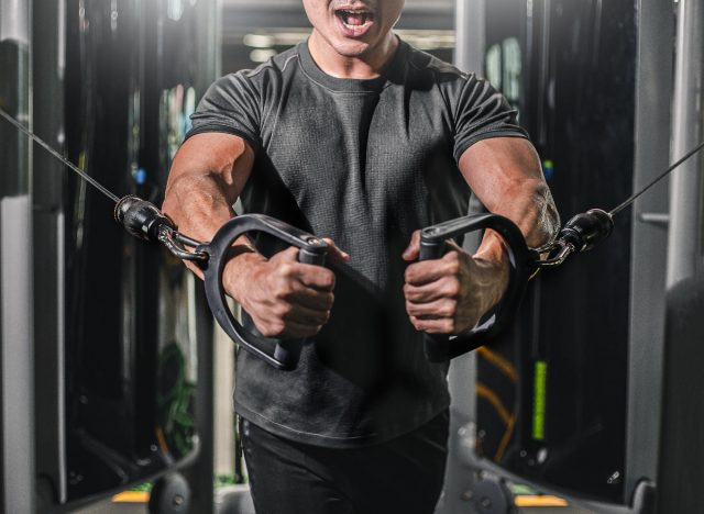 man doing cable chest press exercise