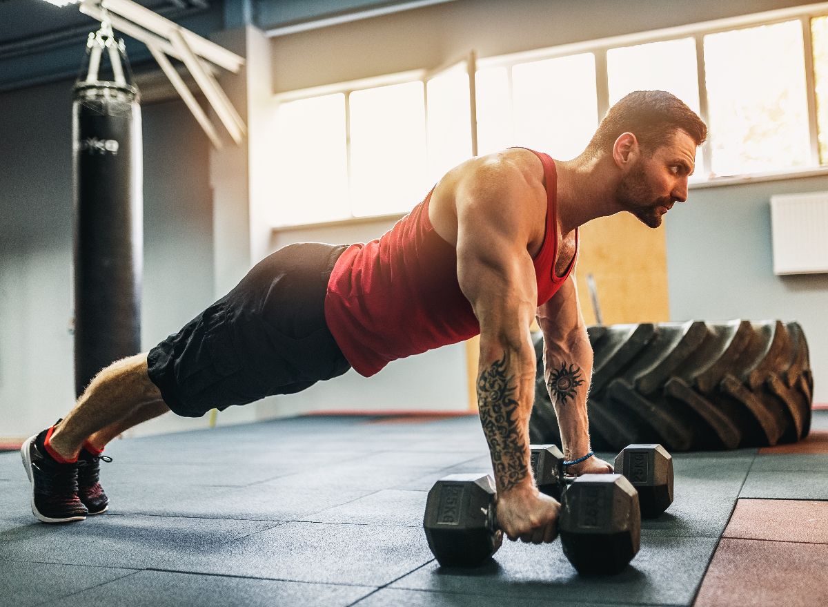 man doing dumbbell pushups, dumbbell exercises for your back