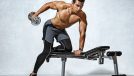 muscular man exercising on workout bench, concept of dumbbell exercises for bigger triceps