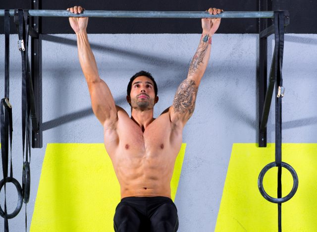 fit man doing pull-ups, demonstrating exercises to prevent a dad bod by 40