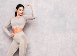 fit woman flexing, concept of easy ways to get in better shape