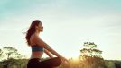 fit woman meditating on sunny morning, concept of how to stay fit without exercising