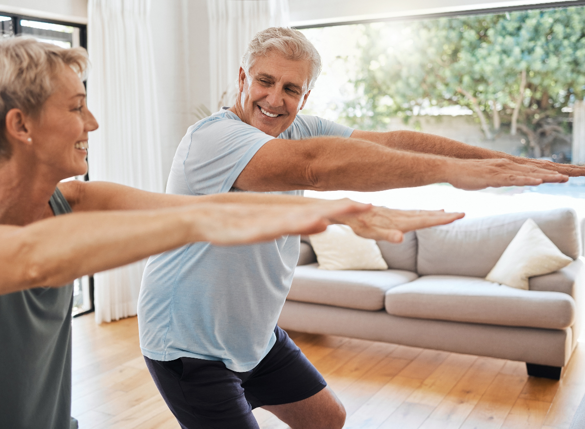 mature couple doing squats, exercises for lower-body strength