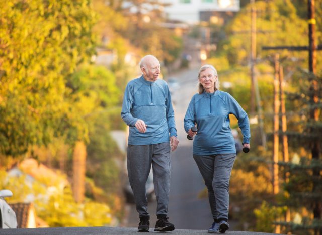 mature couple walking uphill