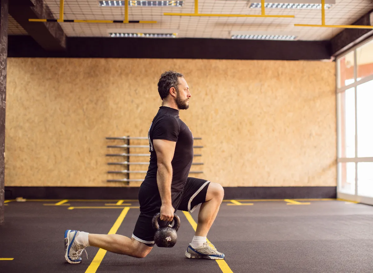 middle-aged man doing kettlebell lunges, exercises for men to stay fit after 50