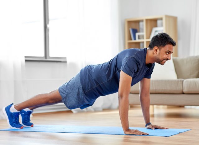 man doing pushups at home demonstrating how to reach your ideal weight fast without equipment