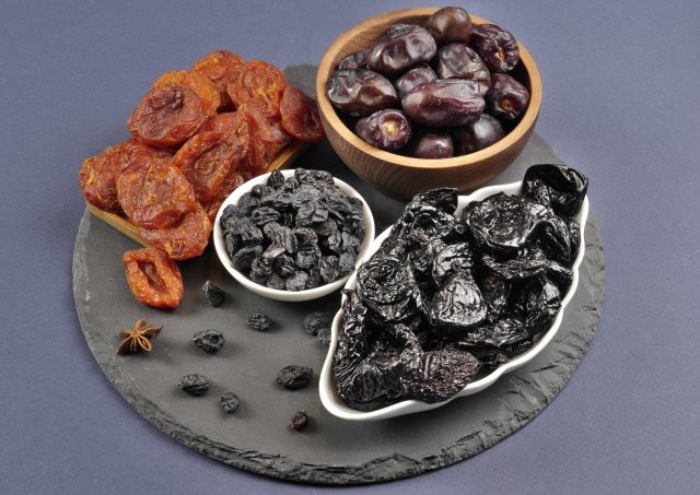 A mix of dried fruits. Dried apricots, prunes, raisins, dates.