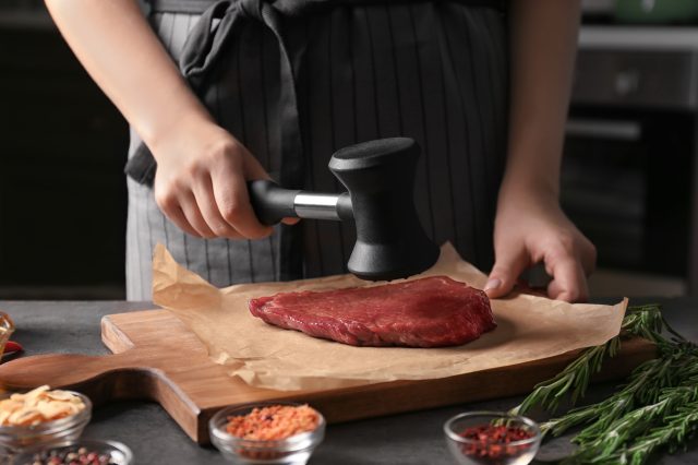 tenderizing steak with a mallet