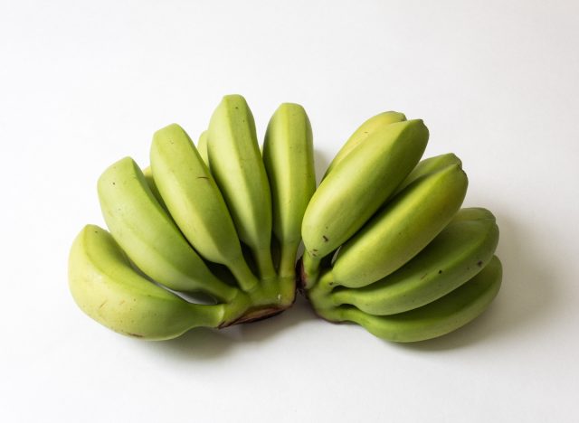 bunches of underripe bananas