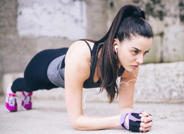 woman holding forearm plank position