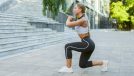 woman doing split squats, walking lunges as part of workout to lose weight and build muscle