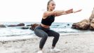 woman squatting, demonstrating beach workout exercises to help you poop