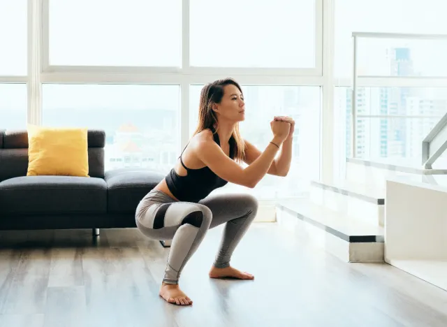 woman squatting, doing exercises to help you poop at home