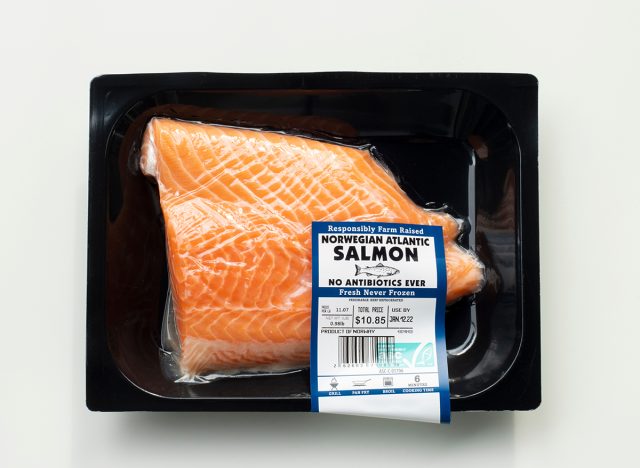 Fresh Norwegian Atlantic salmon fillet in an air-tight plastic packaging with an ASC (Aquaculture Stewardship Council) responsibly farmed label 