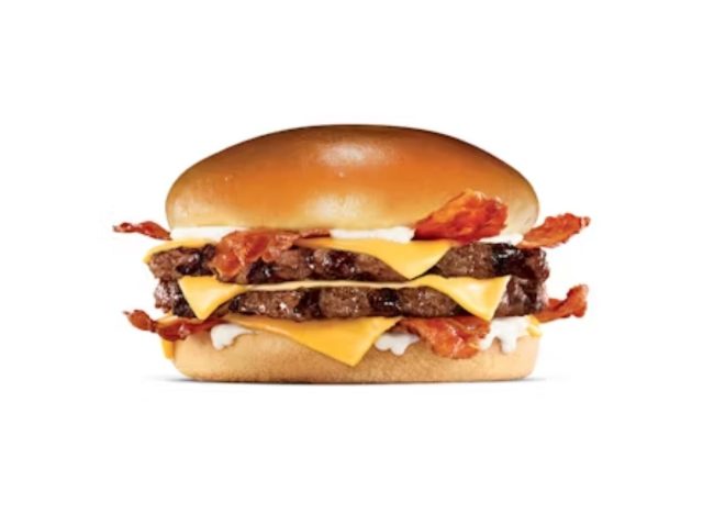 Monster burger from Hardee's on a white background