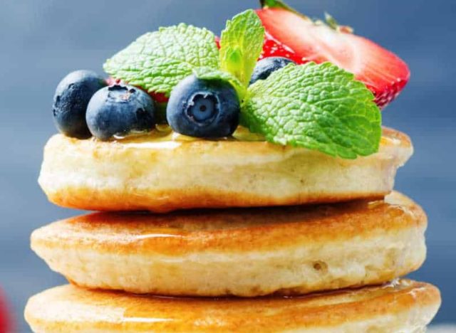 stack of keto pancakes with berries on top