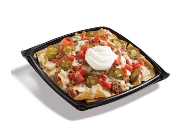 Del Taco queso loaded nachos on a white background