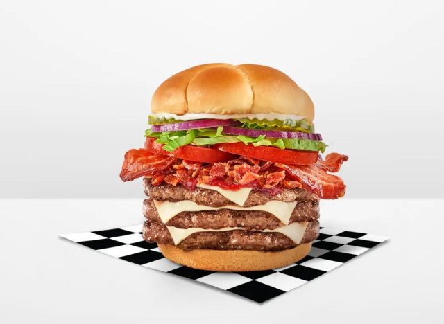 Rally's Bacon Buford Burger on a checkered napkin